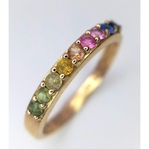 75 - A 14k Yellow Gold Multi-Gemstone Ring. Includes sapphires and peridots. Size I/J. 1.66g weight.