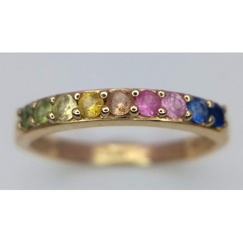 75 - A 14k Yellow Gold Multi-Gemstone Ring. Includes sapphires and peridots. Size I/J. 1.66g weight.