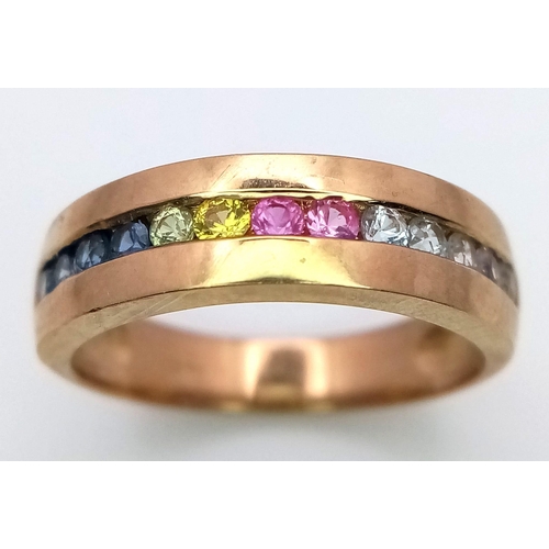 82 - A 9K Yellow Gold Multi-Gemstone Band Ring. Includes sapphires and diamonds. Size L. 3.05g weight.