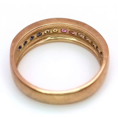 82 - A 9K Yellow Gold Multi-Gemstone Band Ring. Includes sapphires and diamonds. Size L. 3.05g weight.