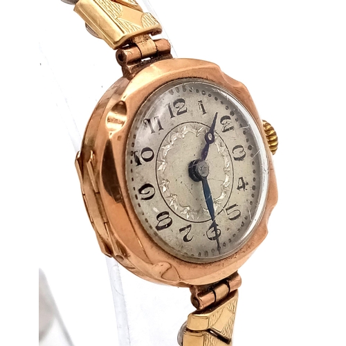 96 - A Vintage 9K Gold Cased Ladies Watch. Expandable gilded strap. 9K gold case - 21mm. White dial. Mech... 