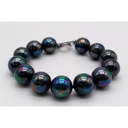 1281 - A Metallic Dark Grey South Sea Pearl Shell Bead Bracelet. Heart clasp. 14mm beads.