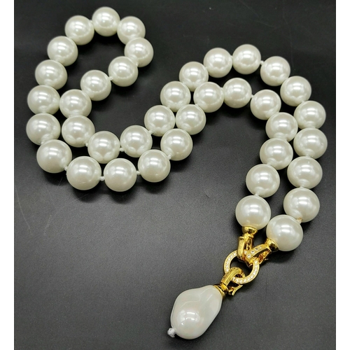 402 - A South Sea Pearl Shell White Bead Necklace with a Baroque Pearl Pendant. Large glossy 14mm beads. G... 