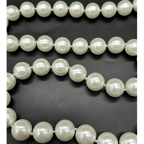 402 - A South Sea Pearl Shell White Bead Necklace with a Baroque Pearl Pendant. Large glossy 14mm beads. G... 