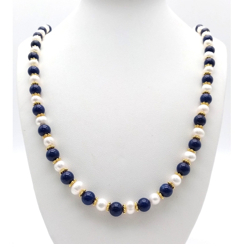 A Matinee Length Lapis Lazuli and Cultured Pearl Necklace. 7/8mm lapis ...