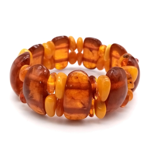 653 - A Wonderful Natural Amber Expandable Bracelet with Honeycomb Amber Spacers.