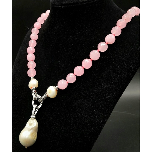 737 - A Very Different Pink Jade and White Keisha Baroque Pearl Necklace. 10mm jade beads give way to an i... 