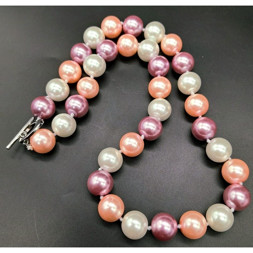 835 - A Pastel Multi-Colour South Sea Pearl Shell Necklace. 12mm beads. Heart clasp. 42cm length.