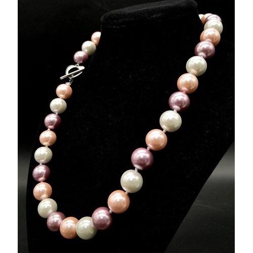 835 - A Pastel Multi-Colour South Sea Pearl Shell Necklace. 12mm beads. Heart clasp. 42cm length.