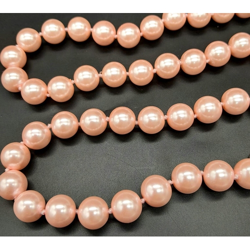 883 - A Bright Pink South Sea Pearl Shell Bead Necklace with Heart Clasp. 12mm beads. 55cm necklace length... 