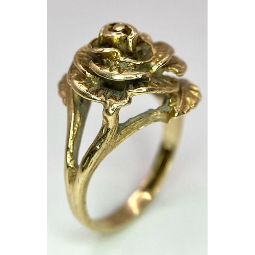 11 - A Vintage 9K Yellow Gold Floral Ring. A decorative ornate central rose. Size L. 5.3g weight.