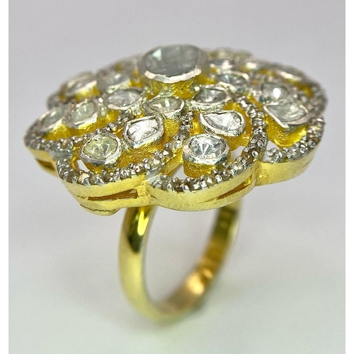 215 - A glorious, silver and gold antique ring with a central natural uncut diamond (1.1 carat appr.) surr... 