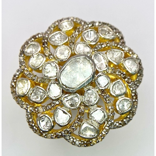 215 - A glorious, silver and gold antique ring with a central natural uncut diamond (1.1 carat appr.) surr... 