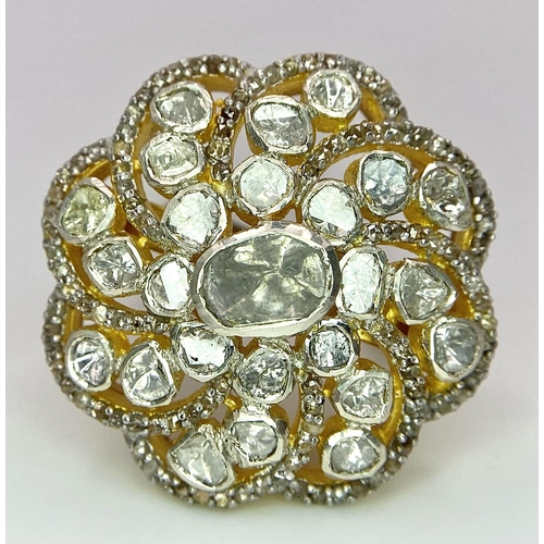 215 - A glorious, silver and gold antique ring with a central natural uncut diamond (1.1 carat appr.) surr... 