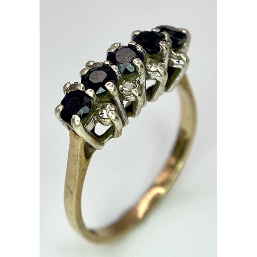 26 - A Classic Vintage Sapphire and Diamond Ring. Five sapphires between four two rows of diamonds. Size ... 