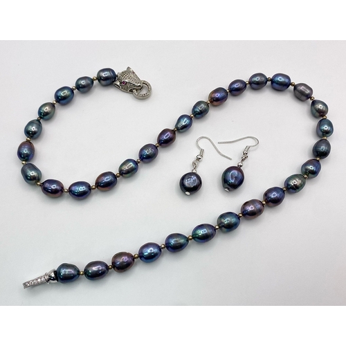 278 - A top quality, metallic grey, natural, Tahitian pearls necklace with a panther clasp adored with rub... 