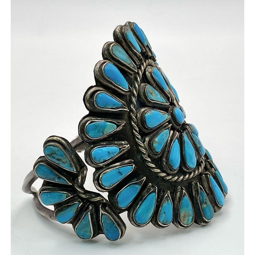 303 - A Vintage Native American Indian Silver and Turquoise Cuff Bracelet. Inlaid geometric teardrop turqu... 