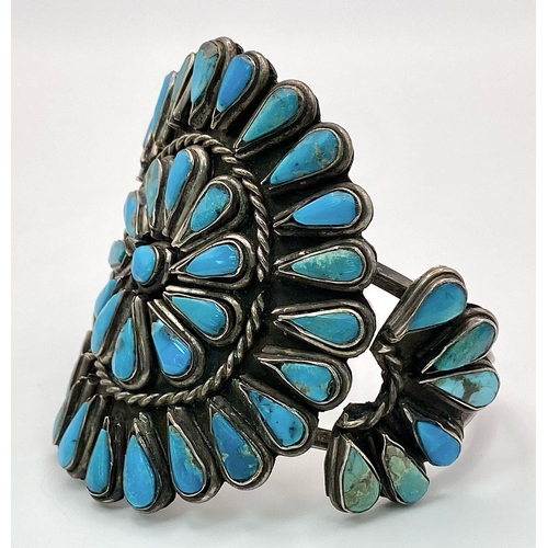 303 - A Vintage Native American Indian Silver and Turquoise Cuff Bracelet. Inlaid geometric teardrop turqu... 