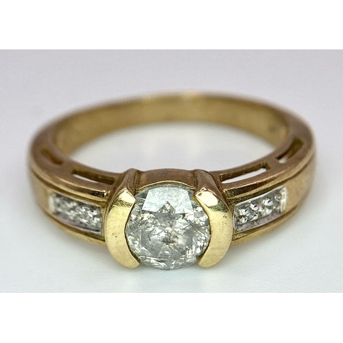 45 - A Vintage 9K Yellow Gold Diamond Ring. Central 0.8ct diamond with winged diamond accents. Size O. 3.... 