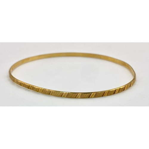 8 - A 9K yellow Gold Thin Bangle. 3mm width. 6cm inner diameter. 3.67g weight.