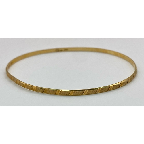 8 - A 9K yellow Gold Thin Bangle. 3mm width. 6cm inner diameter. 3.67g weight.