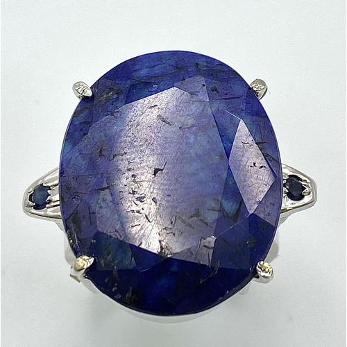 853 - A Large Oval Cut Blue Sapphire 925 Silver Ring. 35ct. W-14.3g. Size O. Comes with a presentation cas... 