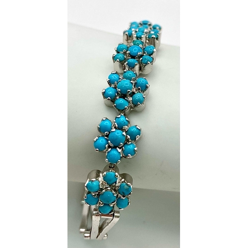 874 - A Turquoise Floral Silver Bracelet. Turquoise-6ctw. W-14g. 21cm length. Ref: HV-2010