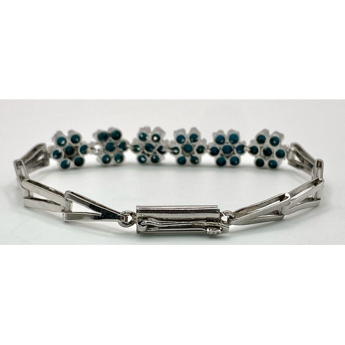 874 - A Turquoise Floral Silver Bracelet. Turquoise-6ctw. W-14g. 21cm length. Ref: HV-2010