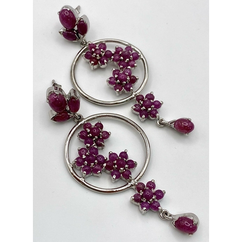 881 - A Pair of Ruby Decorative Floral Drop Earrings set in 925 Sterling silver. 24ctw. W-21.5g. 7cm drop.... 