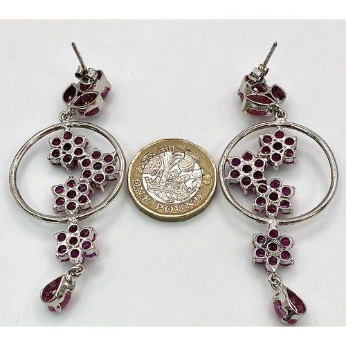 881 - A Pair of Ruby Decorative Floral Drop Earrings set in 925 Sterling silver. 24ctw. W-21.5g. 7cm drop.... 