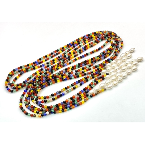 257 - A very interesting necklace consisting of three very long (125 cm) strands of multicoloured beads an... 