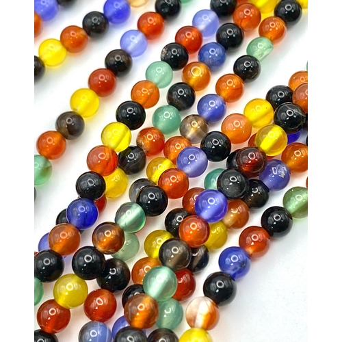 257 - A very interesting necklace consisting of three very long (125 cm) strands of multicoloured beads an... 