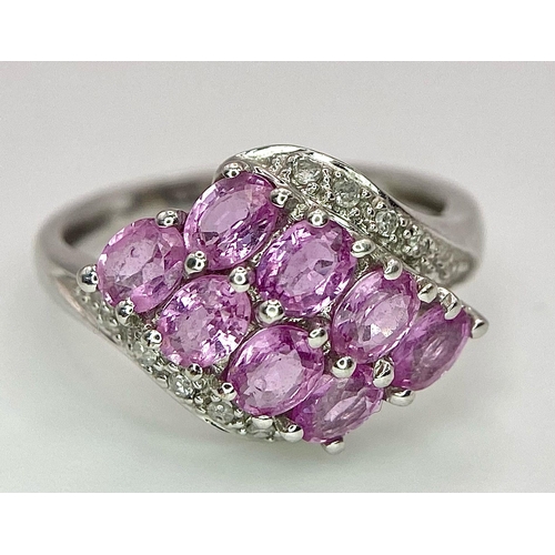 87 - A 9K White Gold Pink Topaz and Diamond Ring. Size J/K. 2.45g weight.