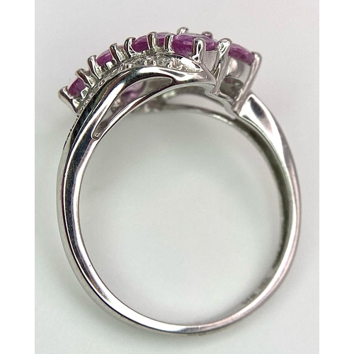 87 - A 9K White Gold Pink Topaz and Diamond Ring. Size J/K. 2.45g weight.