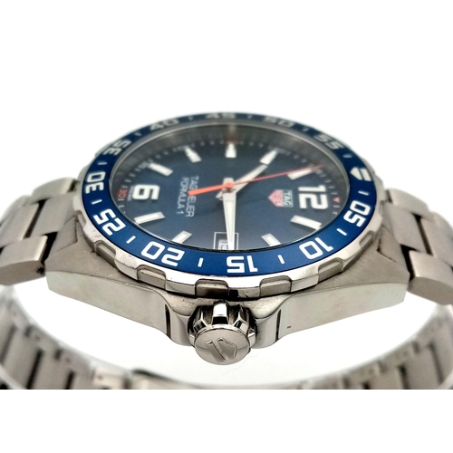 864 - A Tag Heuer Formula 1 Gents Watch. Stainless steel bracelet and case - 43mm. Blue dial with date win... 