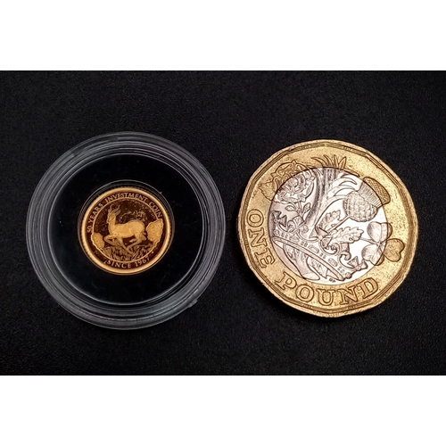 1341 - A 14K Gold Miniature 50 Franc Coin. Comes with a small certificate.