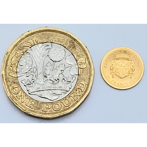 1369 - A 14K Gold Miniature 50 Francs Coin. Comes with a certificate