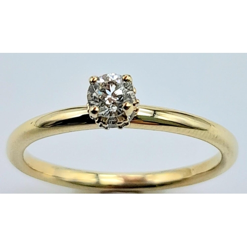 1287 - A 9K YELLOW GOLD DIAMOND SOLITAIRE RING WITH DIAMOND SET HIDDEN HALO 1.9G SIZE O.22CT

A/S 2001