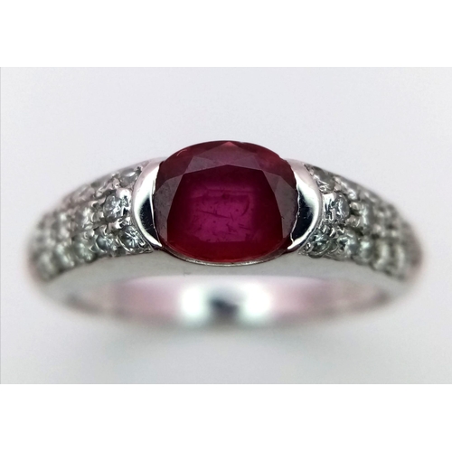 1248 - AN 18K WHITE GOLD DIAMOND & RUBY RING.  0.40CT 4.4G SIZE M.