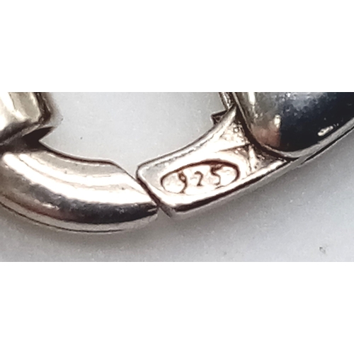 1255 - A STERLING SILVER CURB CHAIN. 20