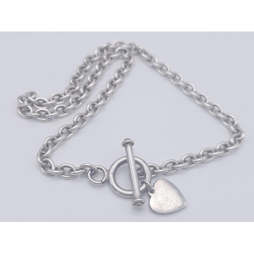 1701 - A Sterling silver T-bar heart necklace with matching 20cm bracelet. 54.3g total weight.