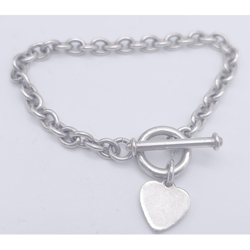 1701 - A Sterling silver T-bar heart necklace with matching 20cm bracelet. 54.3g total weight.