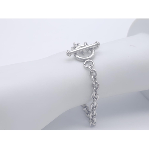 1701 - A Sterling silver T-bar heart necklace with matching 20cm bracelet. 54.3g total weight.