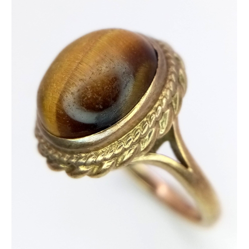 1728 - A Vintage 9K Yellow Gold Tigers Eye Cabochon Ring. Size N. 5g total weight.