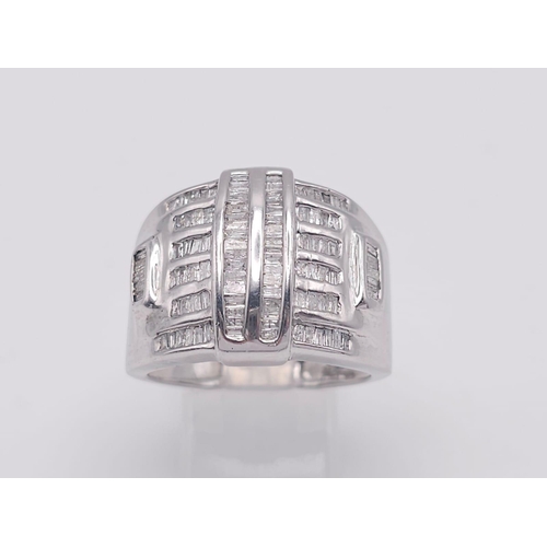 1511 - A 10K White Gold Baguette Diamond Cluster Ring. Size V. 1ctw. 7.4g total weight.