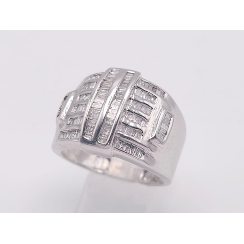 1511 - A 10K White Gold Baguette Diamond Cluster Ring. Size V. 1ctw. 7.4g total weight.