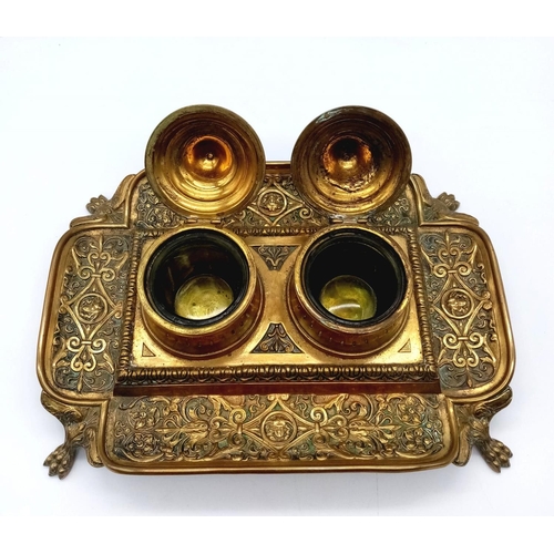 1615 - An Antique Brass (Possibly French) Double Inkwell. Ornate regal scroll decoration throughout with tw... 