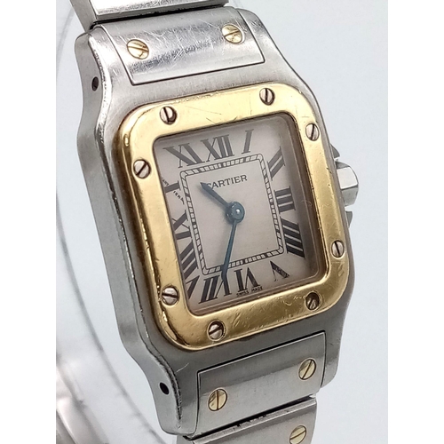 102 - A Cartier Bi-Metal Santos Quartz Ladies Watch. Stainless steel bracelet with gold screws. Bi-metal c... 