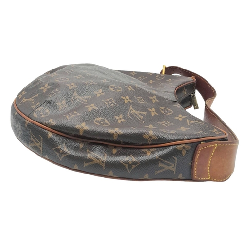 113 - A Louise Vuitton Monogram Croissant GM with Vachetta Leather Trim and Strap. Gold Tone Hardware. 39c... 