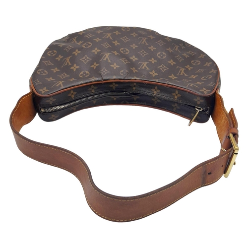 113 - A Louise Vuitton Monogram Croissant GM with Vachetta Leather Trim and Strap. Gold Tone Hardware. 39c... 